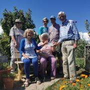 Budleigh Community Allotment team receiving the cheque