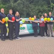 Exmouth Specsavers team celebrate one year of home eye tests