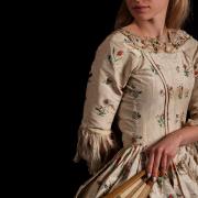 A late 18th century silk and floral embroidered open dress.