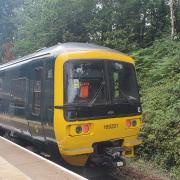 An outbound Exmouth train at Exeter Digby and Sowton.