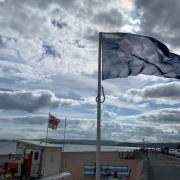 Exmouth's blue flag above seafront.