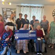 Residents and staff at the care home raised money through a cream tea garden event