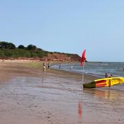 Red flags indicate no swimming in the sea at Exmouth today.