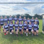 The girls in their purple kits