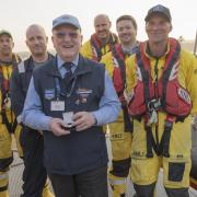 Brian Cole (middle) was rescued by the RNLI after falling off a cliff 65 years ago