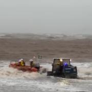 A group of three volunteers from the RNLI helped bring two wing surfers to safety.