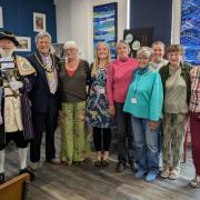 Open Door Exmouth hosts various activities ranging from sewing and knitting to printing, drawing, and crocheting