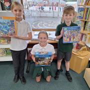 Seb, Lucas and Bells with the new puzzles, which were donated by an anonymous donor