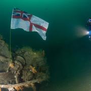 The white ensign planted on HMS Exmouth.