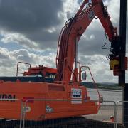 Steel pile wall installation on Exmouth seafront, near sideshore, April 2024.