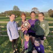 The Year 5/6 girls' cross-country team became East Devon Cross Country Champions