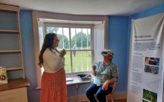 Volunteers and staff trying the virtual reality headset