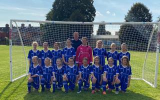 The Exmouth U12 Girls squad with new team sponsor Scott Gray