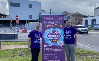 Andy Keeble and Tom Darby Clark from the Royal Devon Hospitals Charity in front of where the new theatre will be.