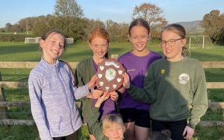 The Year 5/6 girls' cross-country team became East Devon Cross Country Champions